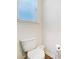 Small bathroom with white toilet and wood floor at 314 Black Birch Dr, Summerville, SC 29486