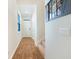 Bright hallway with wood flooring, leading to stairs and front door at 314 Black Birch Dr, Summerville, SC 29486
