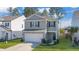 Two-story house, gray siding, white garage door, and small front yard at 314 Black Birch Dr, Summerville, SC 29486