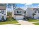 Two-story house with gray siding, white garage door, and landscaped lawn at 314 Black Birch Dr, Summerville, SC 29486
