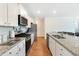 Modern kitchen with granite countertops, stainless steel appliances, and ample cabinet space at 314 Black Birch Dr, Summerville, SC 29486