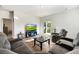 Living area with sectional sofa, hardwood floors, and backyard access at 314 Black Birch Dr, Summerville, SC 29486