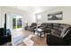 Spacious living room with sectional sofa, hardwood floors, and access to backyard at 314 Black Birch Dr, Summerville, SC 29486