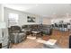 Open living room with sectional sofa and hardwood floors, adjacent to kitchen at 314 Black Birch Dr, Summerville, SC 29486