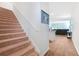 Carpeted staircase with wooden flooring in the hallway at 314 Black Birch Dr, Summerville, SC 29486