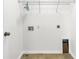 Laundry room with tile floor, metal shelving, and hook for hanging clothes at 319 Deep River Rd, Summerville, SC 29486