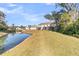 Spacious backyard with pond and neighboring houses visible at 7833 Montview Rd, North Charleston, SC 29418