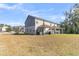 Large backyard with a covered patio and a view of the neighborhood at 7833 Montview Rd, North Charleston, SC 29418