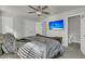 Spacious bedroom with a large bed, en-suite bathroom access, and a mounted TV at 7833 Montview Rd, North Charleston, SC 29418