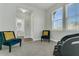 Second bedroom with two armchairs and a massage chair at 7833 Montview Rd, North Charleston, SC 29418