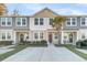 Townhouses with two-toned siding, landscaping, and a driveway at 7833 Montview Rd, North Charleston, SC 29418