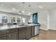 Modern kitchen with dark cabinets, quartz countertops and island at 7833 Montview Rd, North Charleston, SC 29418