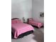 Spacious bedroom with a queen bed and twin bed, offering comfortable accommodations at 9002 Palmetto (1/13 Share) Dr # 517, Isle of Palms, SC 29451