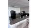 Well-equipped kitchen with white cabinets and granite countertops at 9002 Palmetto (1/13 Share) Dr # 517, Isle of Palms, SC 29451