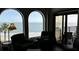 Serene ocean view from living room with arched windows at 9002 Palmetto (1/13 Share) Dr # 517, Isle of Palms, SC 29451
