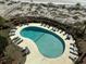 Inviting kidney-shaped pool with plenty of lounge chairs at 9002 Palmetto (1/13 Share) Dr # 517, Isle of Palms, SC 29451