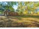 Landscaped backyard with brick home and wooden fence at 110 Edgebrook Dr # 28, Summerville, SC 29486