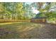 Sun-drenched backyard with brick home and wooden fence at 110 Edgebrook Dr # 28, Summerville, SC 29486