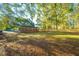 Private backyard with mature trees and wooden fence at 110 Edgebrook Dr # 28, Summerville, SC 29486
