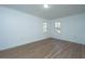 Spacious bedroom with hardwood floors and two windows at 110 Edgebrook Dr # 28, Summerville, SC 29486