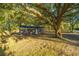 Brick ranch house nestled under a large oak tree, with a fenced yard at 110 Edgebrook Dr # 28, Summerville, SC 29486