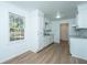 Efficient kitchen with white cabinets and laminate flooring at 110 Edgebrook Dr # 28, Summerville, SC 29486