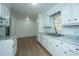 Kitchen with white cabinets, marble countertops, and stainless steel sink at 110 Edgebrook Dr # 28, Summerville, SC 29486
