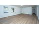 Open living room with hardwood floors and access to other rooms at 110 Edgebrook Dr # 28, Summerville, SC 29486