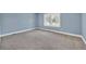 Bright bedroom featuring neutral walls and carpet flooring at 118 Carter, Walterboro, SC 29488