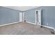Well-lit bedroom with grey carpet and access to multiple rooms at 118 Carter, Walterboro, SC 29488
