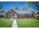 Brick home with gray roof, landscaped lawn, and walkway at 118 Carter, Walterboro, SC 29488