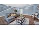 Living room with gray sectional sofa and hardwood floors at 118 Carter, Walterboro, SC 29488