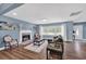 Living room with fireplace, hardwood floors, and comfy seating at 118 Carter, Walterboro, SC 29488