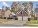 Brick home with a two-car garage and manicured lawn at 119 Summer Trace Dr, Summerville, SC 29485