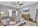 Main bedroom with a king-size bed, dresser, and TV mounted on the wall at 119 Summer Trace Dr, Summerville, SC 29485