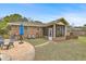 Backyard view showing screened porch, patio, and partial view of the pool at 1323 White House Blvd, Charleston, SC 29412