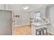 Efficient galley kitchen with white cabinets, stainless steel appliances, and tile flooring at 1323 White House Blvd, Charleston, SC 29412