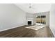 Bright living room with fireplace and sliding glass doors to patio at 1370 Pinnacle Rd, Charleston, SC 29412