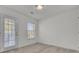 Bedroom with door to outside deck and neutral decor at 1565 Ashley Garden Blvd, Charleston, SC 29414