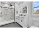 Elegant bathroom featuring a marble shower, double vanity, and stylish fixtures at 2015 Groveland Ave, North Charleston, SC 29405