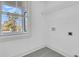 Laundry room with tile floor, shelving, and window at 2015 Groveland Ave, North Charleston, SC 29405