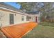 Backyard view of home showing deck and sunroom addition at 212 Windsor Mill Rd, Goose Creek, SC 29445