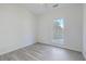 Bright bedroom with grey wood-look flooring and large window at 212 Windsor Mill Rd, Goose Creek, SC 29445