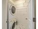 Laundry room with washer and dryer, shelving and marble-look tile floor at 212 Windsor Mill Rd, Goose Creek, SC 29445