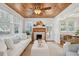 Living Room with white sofa, wood ceiling, and fireplace at 2149 Edisto Ave, Charleston, SC 29412