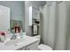 Clean bathroom with a white vanity, shower, and linen cabinet at 2347 Tall Sail Dr # J, Charleston, SC 29414