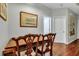Small wooden table with two chairs in a hallway dining area at 2347 Tall Sail Dr # J, Charleston, SC 29414