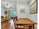 Rustic wooden dining table with four chairs in a bright dining area at 2347 Tall Sail Dr # J, Charleston, SC 29414