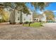 Building exterior with landscaping and a gravel path at 2347 Tall Sail Dr # J, Charleston, SC 29414
