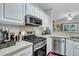 Kitchen with stainless steel appliances and white cabinets at 2347 Tall Sail Dr # J, Charleston, SC 29414